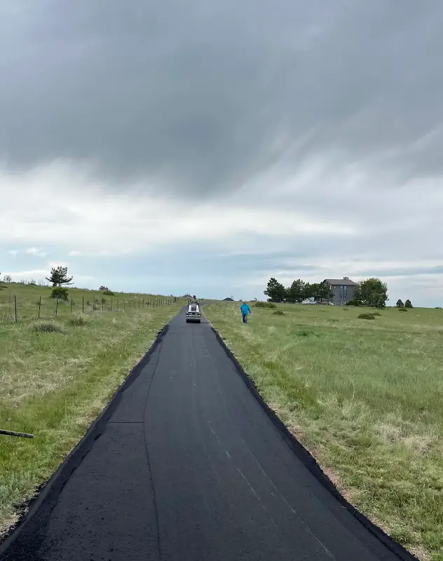 Long asphalt driveway in Parker being installed