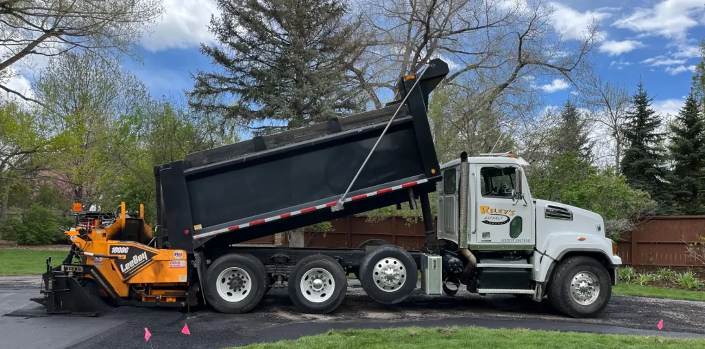 Asphalt being installed on a driveway in Parjer, CO